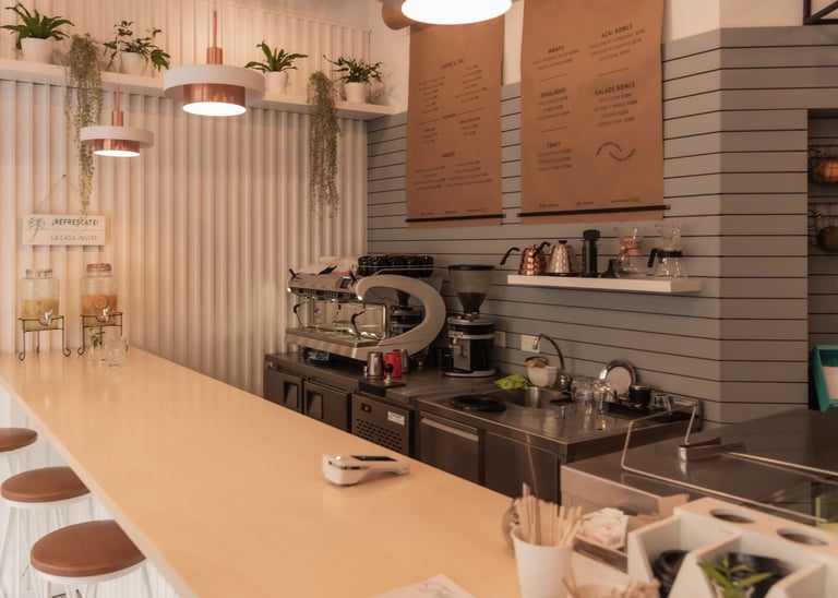 Interior of a coffee shop with counter and espresso machine